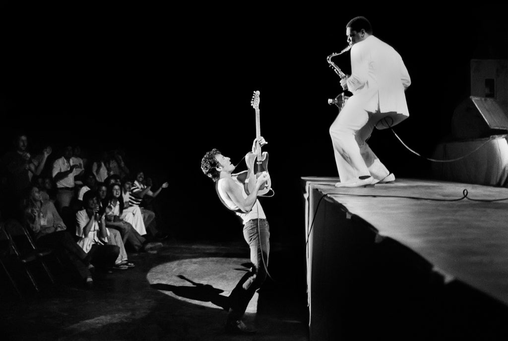 Bruce Springsteen Playing From the Crowd to Clarence Clemons on Stage, 1978