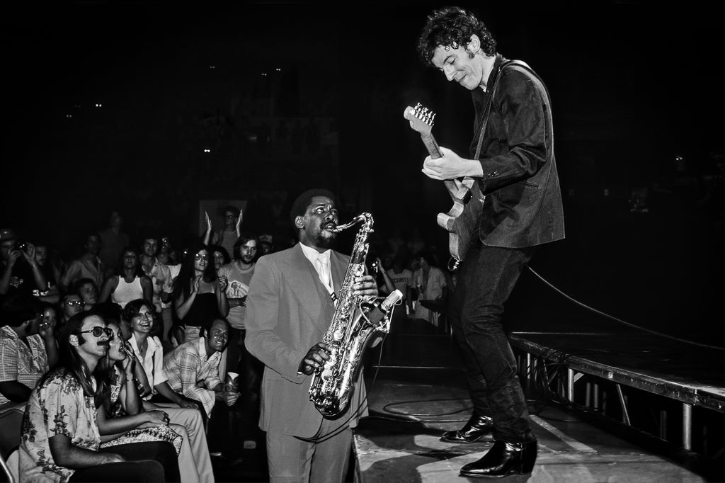 Clarence Clemons Playing From the Crowd to Bruce Springsteen on Stage, 1978
