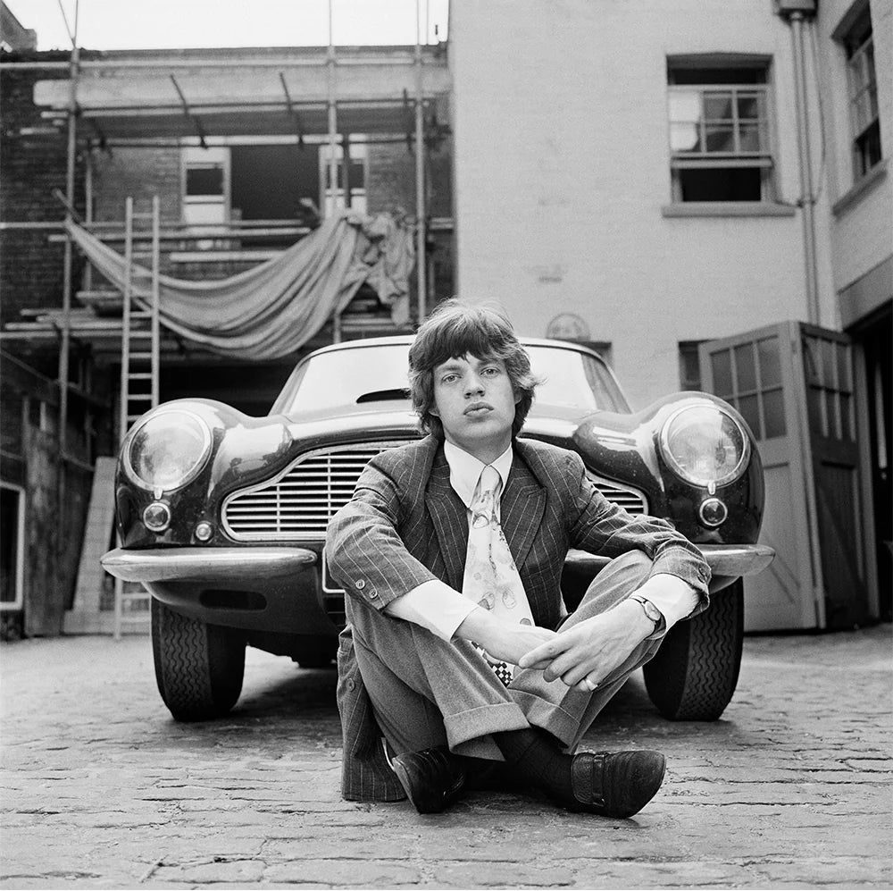 Mick Jagger with his Aston Martin DB6, 1966